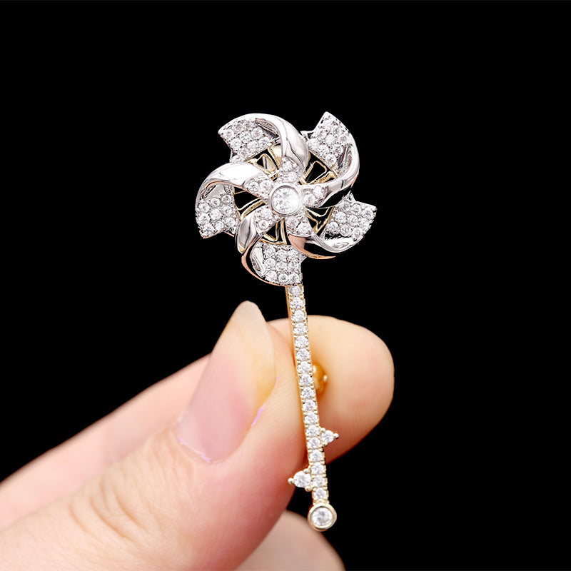 2025 2023 new rotating windmill brooch Korean version autumn and winter suit inlaid with zircon corsage women's coat pin accessories