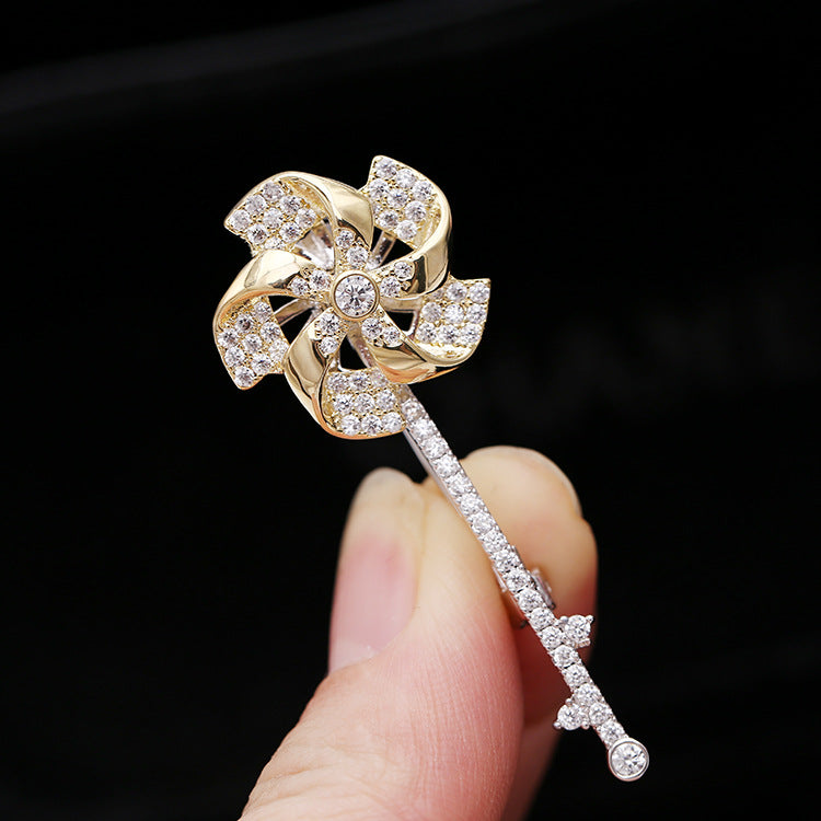 2025 2023 new rotating windmill brooch Korean version autumn and winter suit inlaid with zircon corsage women's coat pin accessories