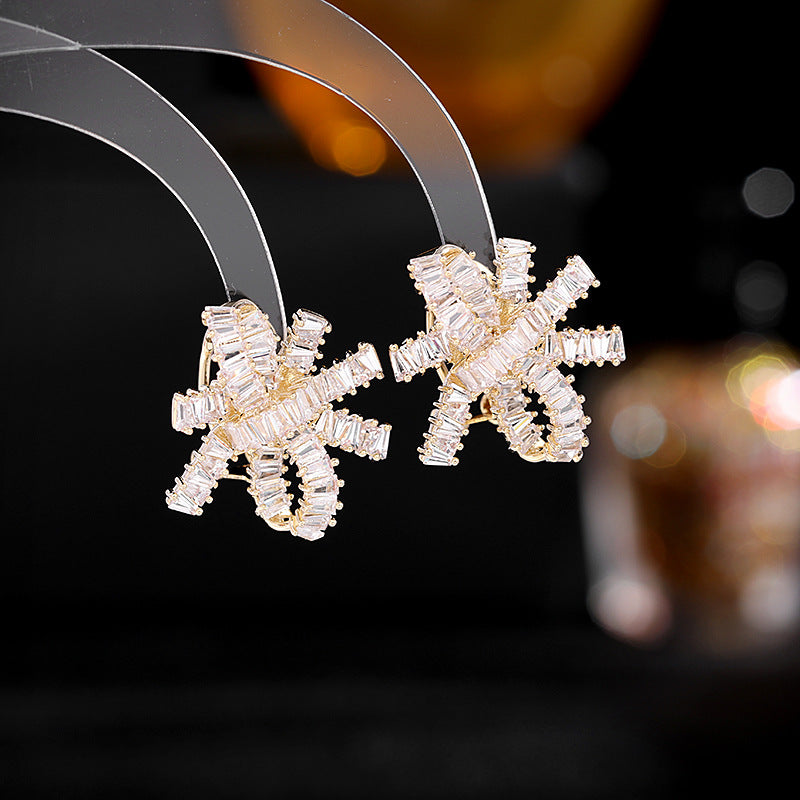 2025 S925 silver needle super flash zircon inlaid earrings women's light luxury high-end wedding earrings streamer bow earrings
