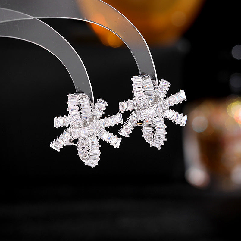 2025 S925 silver needle super flash zircon inlaid earrings women's light luxury high-end wedding earrings streamer bow earrings
