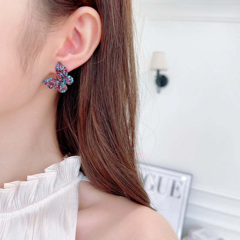 2025 New niche temperament high-end earrings wholesale fashion full diamond color zircon inlaid retro style butterfly stud earrings