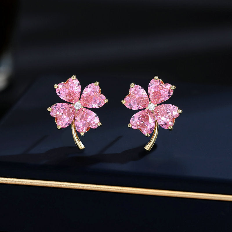 2025 Fresh and sweet super fairy temperament earrings s925 silver needle Korean version niche love-shaped zircon inlaid lucky grass stud earrings