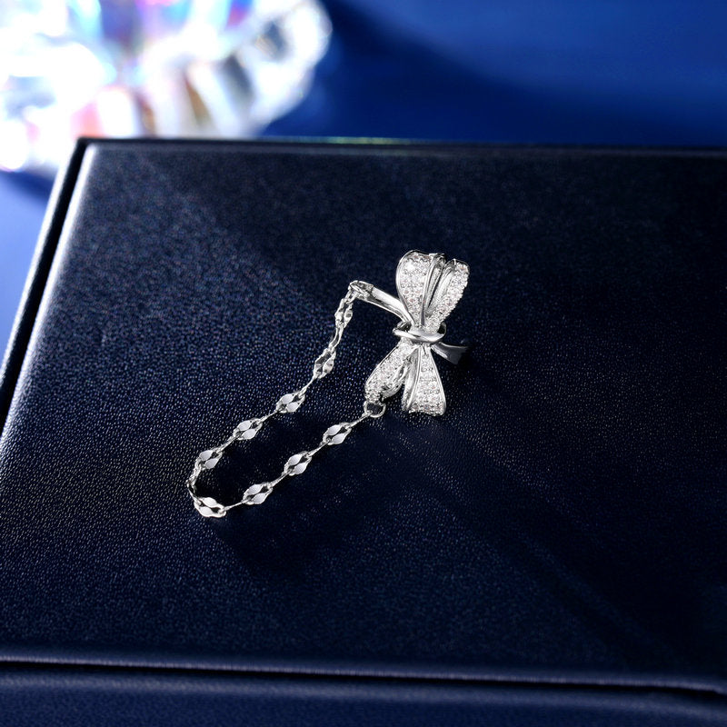 2025 Korean version of fashion tassel earless earrings pendant women's niche personalized earrings bow zircon inlay single earbone clip