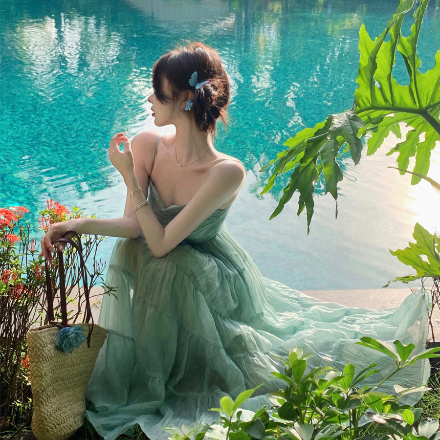 2025 Beautiful seaside vacation photo high-end waist method beach halter big skirt suspender a word long dress