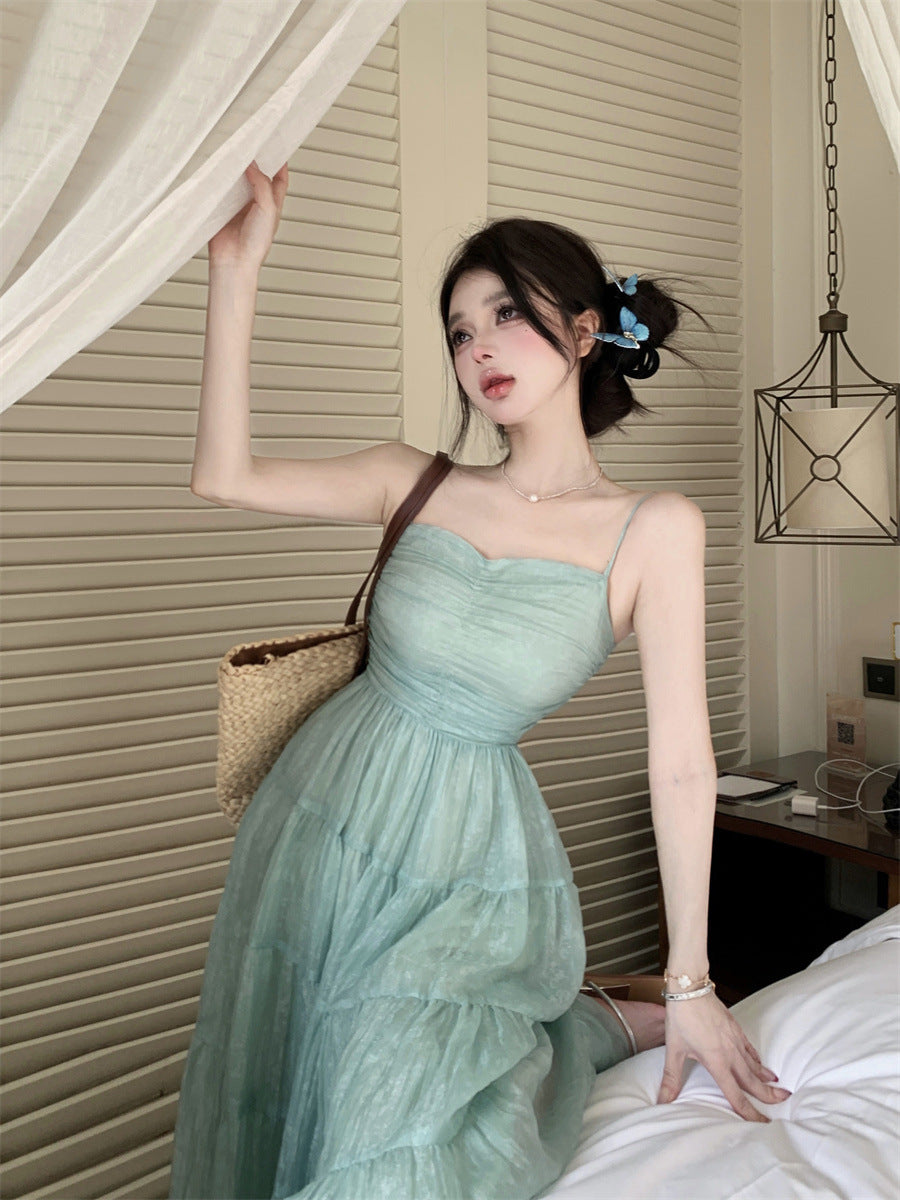 2025 Beautiful seaside vacation photo high-end waist method beach halter big skirt suspender a word long dress