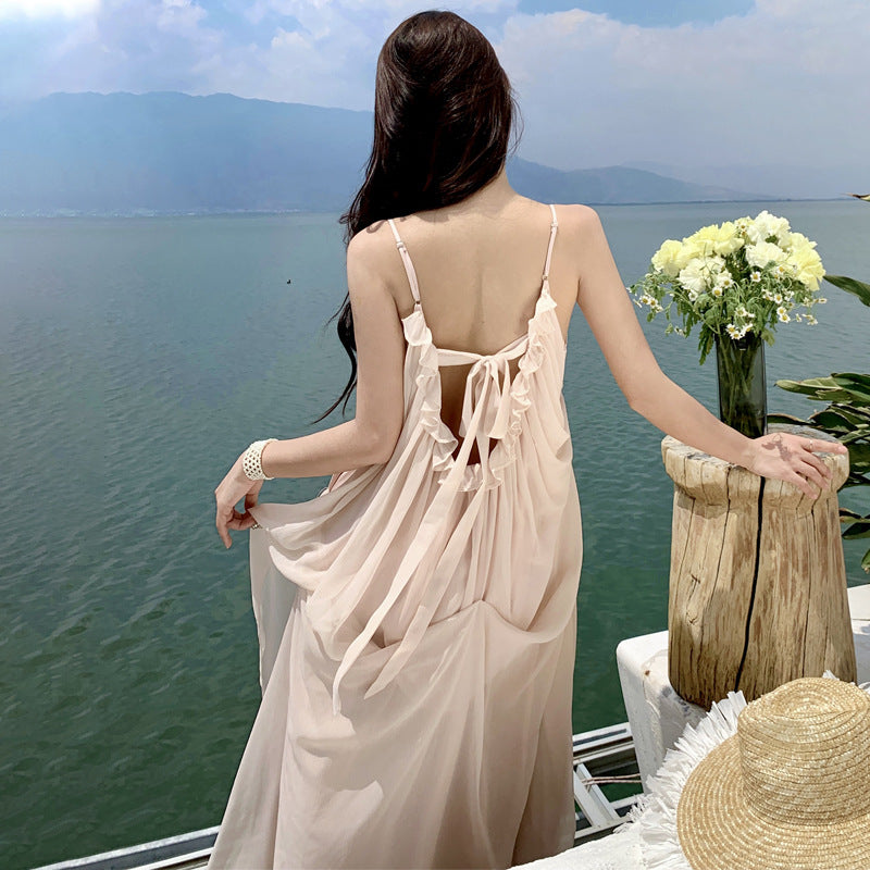 2025 Seaside Banna vacation dress super fairy high-end design naked pink fungus edge halter suspender big swing dress