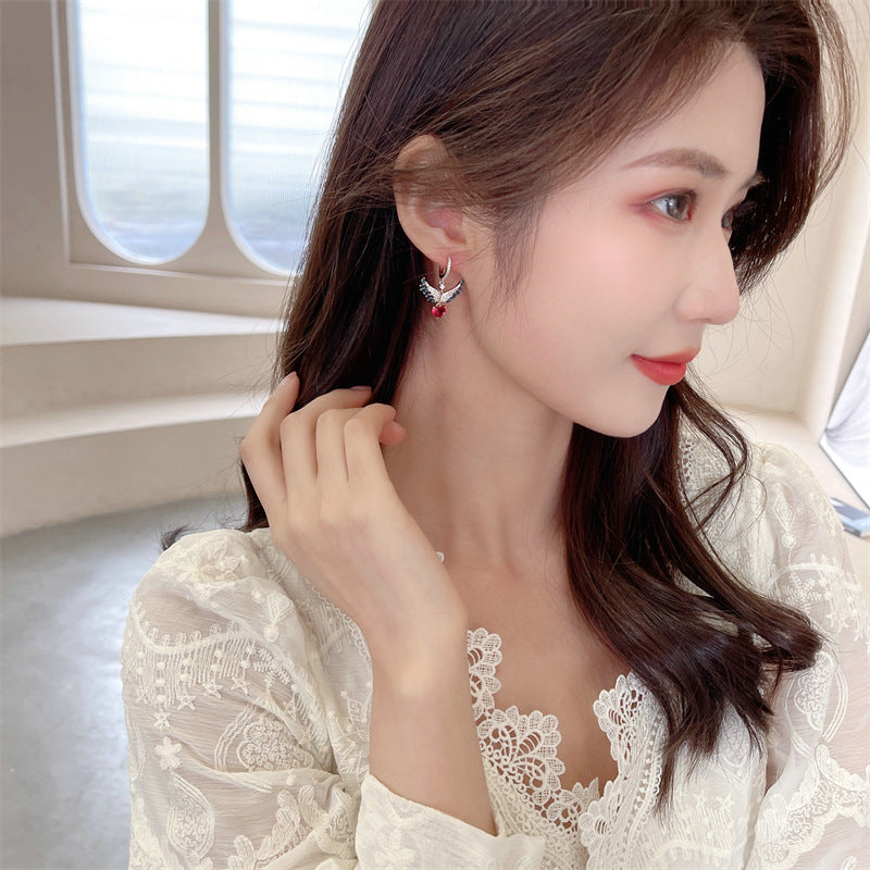 2025 Sweet and fresh girlish temperament earrings, slightly inlaid zircon earrings, niche design, angel wings, love ear buckles.