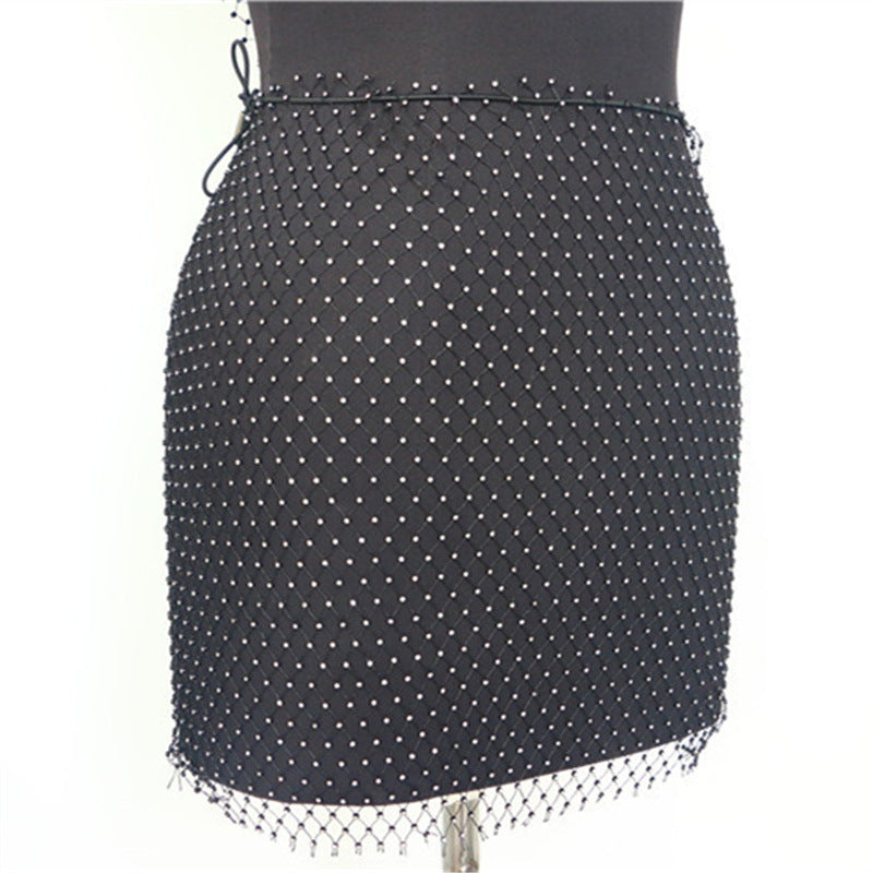 2025  YL2217  factory direct hair Popular trade supply fashionable hollow mesh fishing net clothes small vest skirt set