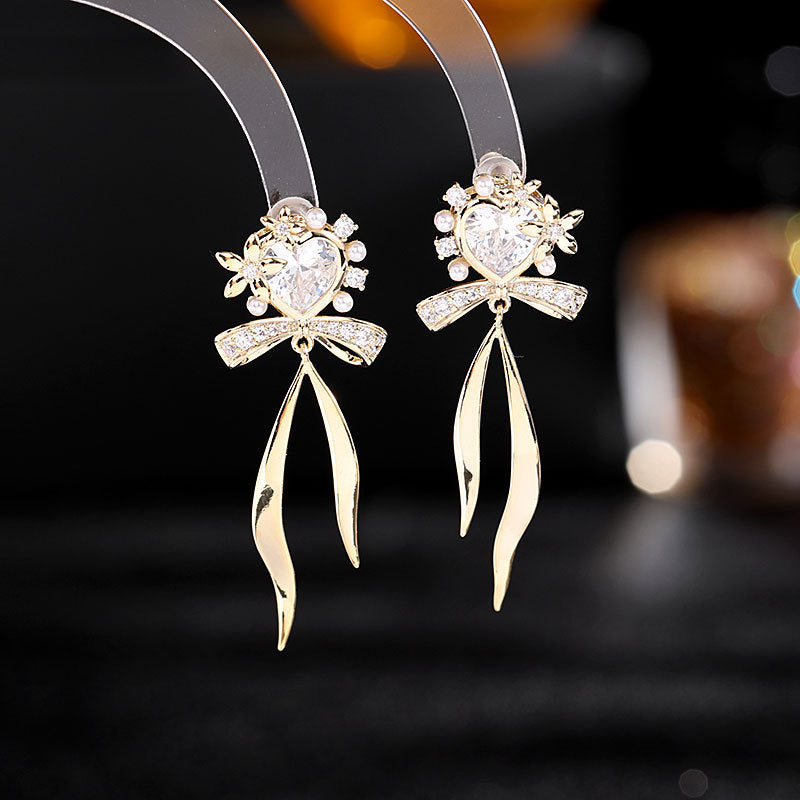 2025 Korean version of fresh temperament sweet girl heart earrings zircon stud earrings s925 silver needle streamer bow love earrings