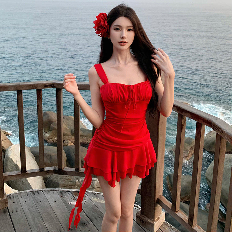 2025 beautiful red suspender dress women's summer small irregular design sexy seaside vacation skirt