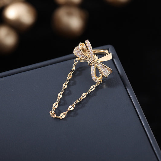 2025 Korean version of fashion tassel earless earrings pendant women's niche personalized earrings bow zircon inlay single earbone clip