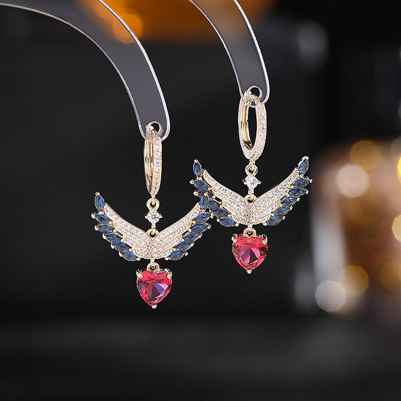 2025 Sweet and fresh girlish temperament earrings, slightly inlaid zircon earrings, niche design, angel wings, love ear buckles.