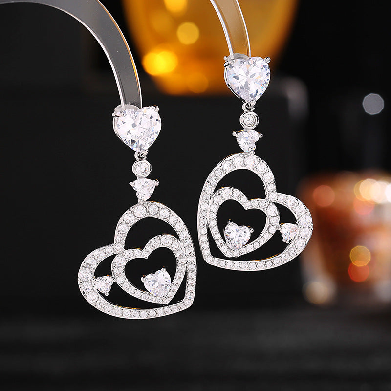 2025 S925 silver needle zircon inlaid earrings wedding dress with light luxury and high-end heart-to-heart love earrings