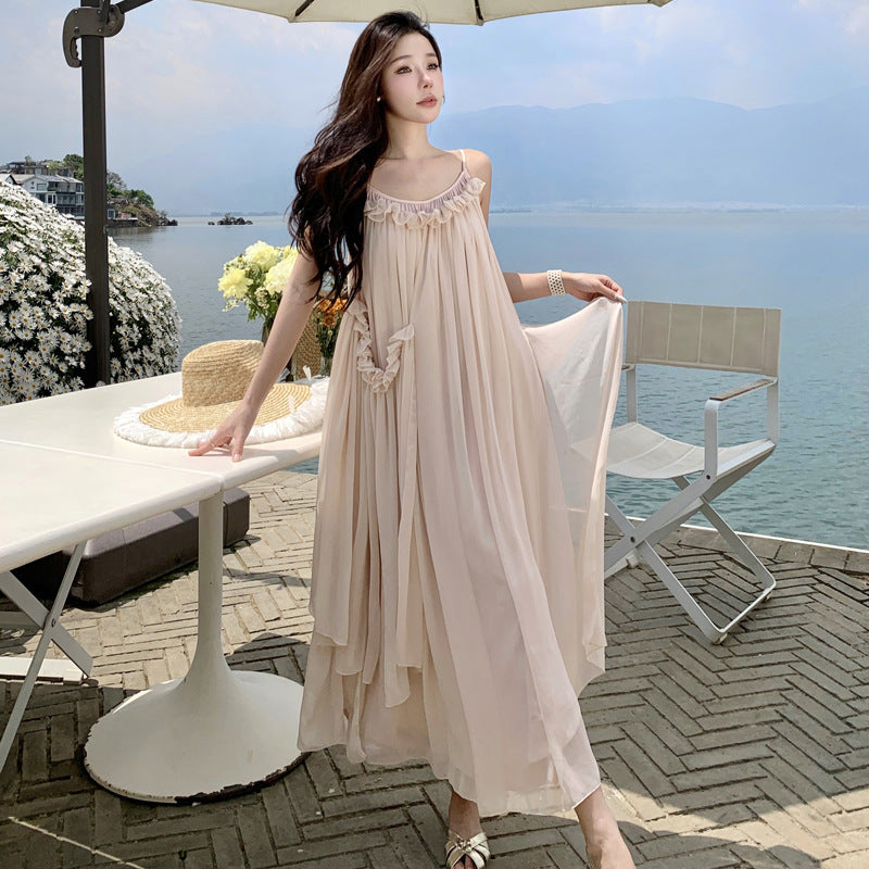 2025 Seaside Banna vacation dress super fairy high-end design naked pink fungus edge halter suspender big swing dress